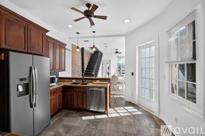 New Orleans apartment for rent - A bedroom with a large bed and a chandelier.