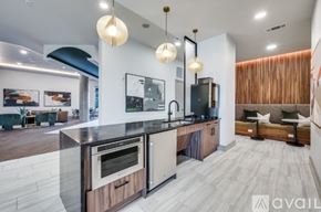 Frisco apartment for rent - A modern kitchen with a wooden island and stainless steel appliances.