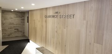 Ottawa apartment for rent - A hallway with a wooden wall and a sign that says Clarence Street.