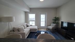Dryden apartment for rent - A living room with a couch, chairs, and a television.