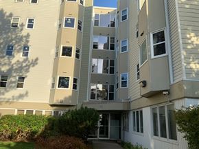 Halifax apartment for rent - A tall apartment building with a balcony on the second floor.