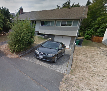 Victoria apartment for rent - A gray car is parked in front of a house.