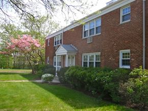Metuchen apartment for rent - A red brick house with a white door and windows.