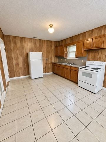 Louisville apartment for rent - A kitchen with white appliances and wooden cabinets.