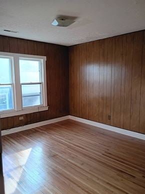 Louisville apartment for rent - A room with wooden floors and a window.