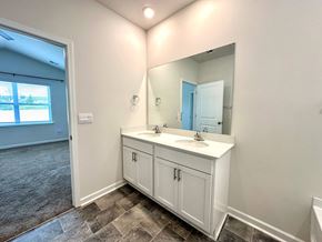 Greer house for rent - A bathroom with a white vanity and a mirror.