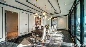 Sarasota townhouse for rent - A modern dining room with a long table and chairs.