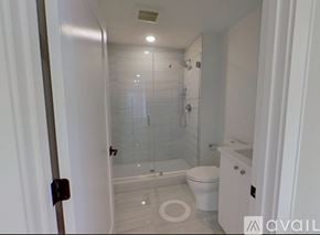 Boston apartment for rent - A bathroom with a toilet, sink, and shower.