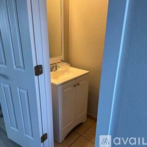 Colorado Springs townhouse for rent - A white cabinet with a sink is in a room.