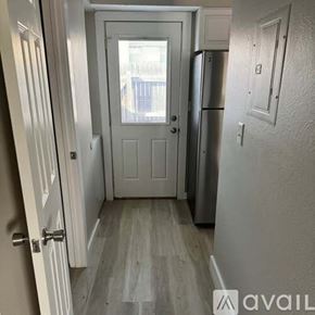 Colorado Springs townhouse for rent - A white door with a window in the middle of a room.