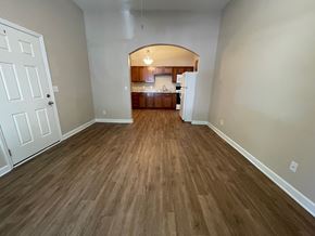 Louisville apartment for rent - A room with wooden flooring and a white door.
