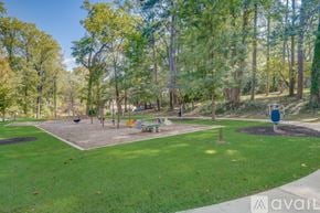 Hapeville house for rent - A park with a playground and trees.