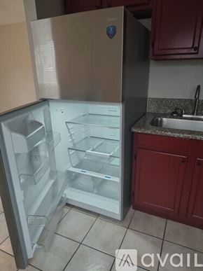 Tampa apartment for rent - A room with a glass door and tiled floor.