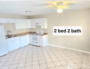 Spring Valley apartment for rent - A kitchen with white appliances and cabinets.