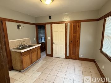 Milwaukee house for rent - A kitchen with a sink and cabinets.