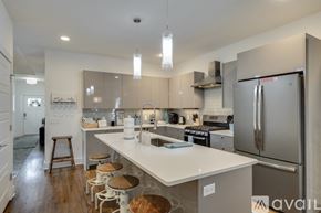 Nashville house for rent - A kitchen with a white counter top and stainless steel appliances.
