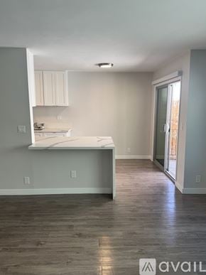 Santa Monica apartment for rent - A kitchen area with a countertop and cabinets.