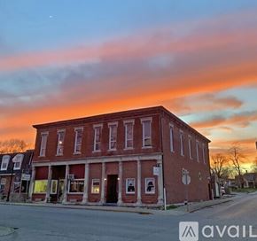Ellettsville apartment for rent - A red brick building with a red door and a black door.