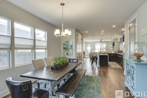Nashville house for rent - A modern dining room with a wooden table and chairs.
