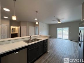 Summerset apartment for rent - A spacious kitchen with a sink, cabinets, and a ceiling fan.