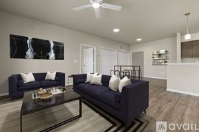Summerset apartment for rent - A living room with a dark blue sofa and a coffee table.