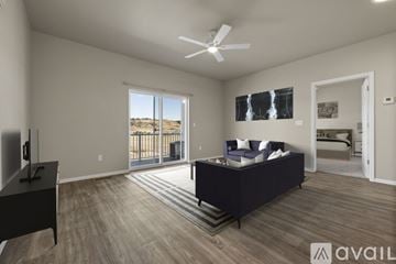 Summerset apartment for rent - A spacious living room with a dark sofa and a television.