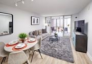 Alexandria apartment for rent - A modern dining room with a round table set for two.