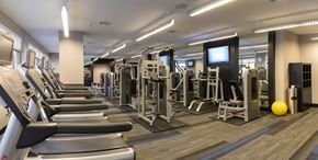 Washington apartment for rent - A gym with treadmills, weights, and exercise machines.