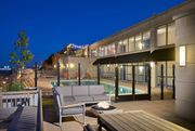 Washington apartment for rent - A patio with a couch, table and a pool.