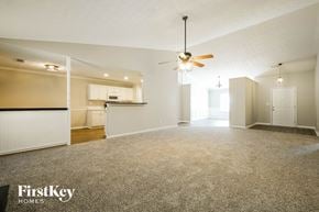 Winder house for rent - A spacious room with a ceiling fan and carpeted floor.