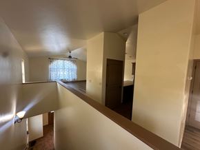 Silt house for rent - A room with a window and a ceiling fan.
