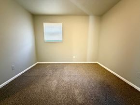 Louisville apartment for rent - A room with a carpeted floor and a window.