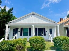 Louisville apartment for rent - A white house with a porch and a green door.