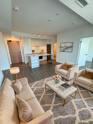 Mississauga apartment for rent - A living room with a white couch and a coffee table.
