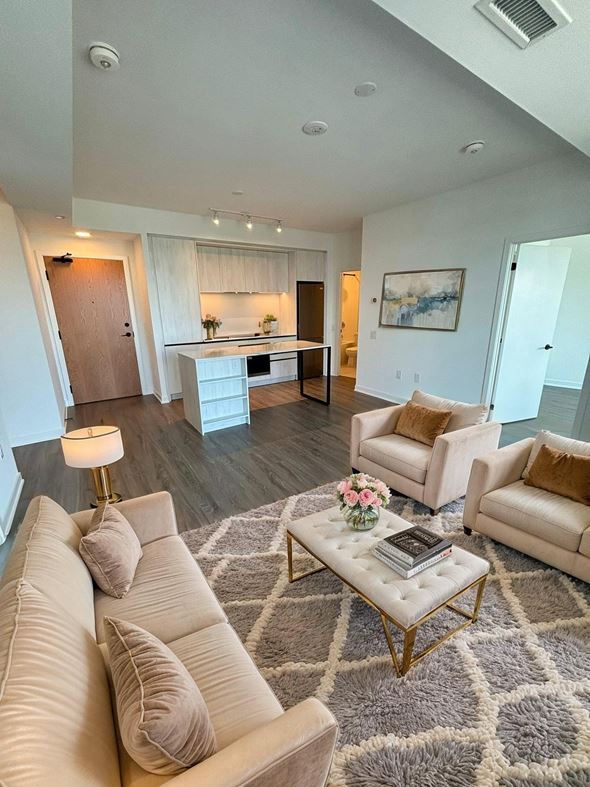 Mississauga apartment for rent - A living room with a white couch and a coffee table.