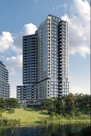 Mississauga apartment for rent - A modern high-rise building with balconies is surrounded by greenery and other buildings.