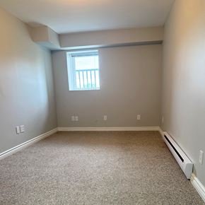 Brandon apartment for rent - A room with a window and a carpeted floor.