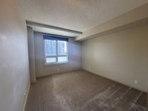 Calgary house for rent - A room with a window and carpeted floor.
