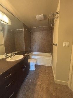 Calgary house for rent - A bathroom with a toilet, sink, and tub.