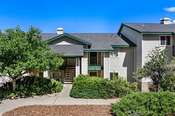 Durango house for rent - A house with a green front door and a grey roof.