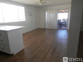 Landers apartment for rent - A room with wooden floors and a ceiling fan.