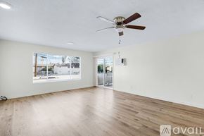 San Bernardino apartment for rent - A room with a ceiling fan and wooden flooring is available for rent.