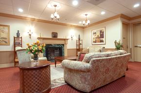 Whitehall apartment for rent - A living room with a fireplace and a couch.