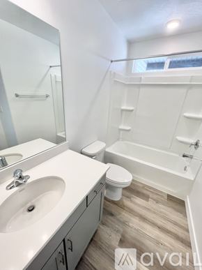 Cedar City townhouse for rent - A bathroom with a white sink, toilet, and bathtub.