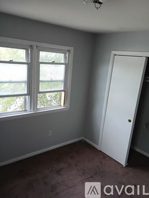 College Park townhouse for rent - A kitchen with a granite countertop and a stove top oven.