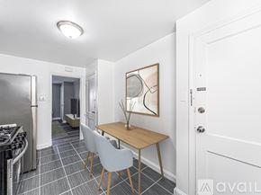 Oaklyn apartment for rent - A kitchen with a table and chairs in the middle of the room.