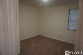 Montgomery house for rent - A room with a window and a carpeted floor.
