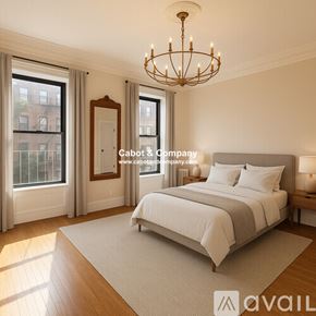 Boston apartment for rent - A bedroom with a large bed, a chandelier, and a view of a city street through the windows.
