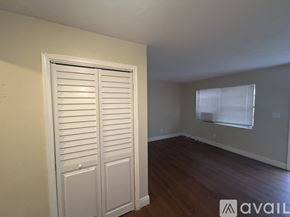 Belle Glade apartment for rent - A room with a white door and a window with blinds.