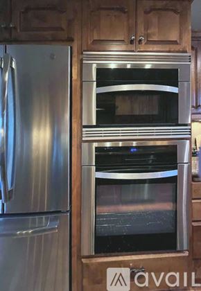 Mount Shasta apartment for rent - A dining room with a wooden table and chairs.